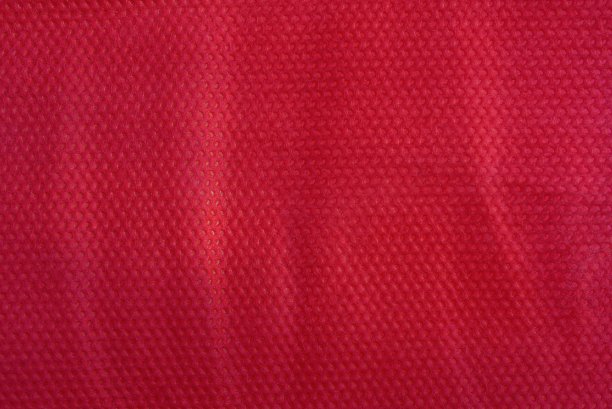 由一块皱褶物质制成的红色织物纹理图片下载