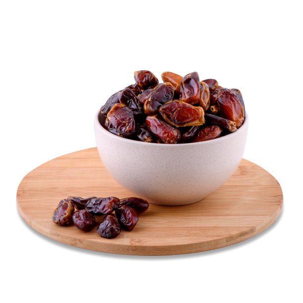 干枣水果在白色的碗在木板孤立在白色的背景，复制空间。图片下载