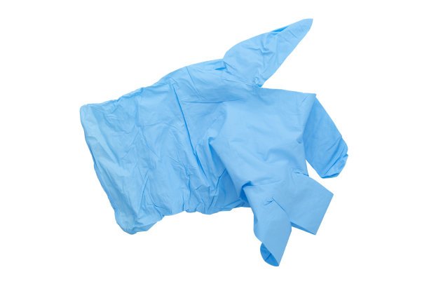 白色背景的Covid-19一次性污染手套。冠状病毒乳胶塑料垃圾。大流行。图片下载