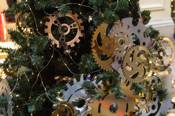 带齿轮的圣诞树的一部分。关闭了。圣诞节的背景图片下载