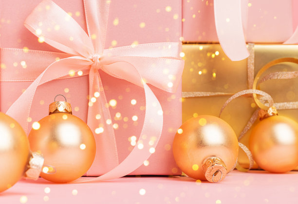 节日金粉盒缎带蝴蝶结玩具球粉背景图片下载