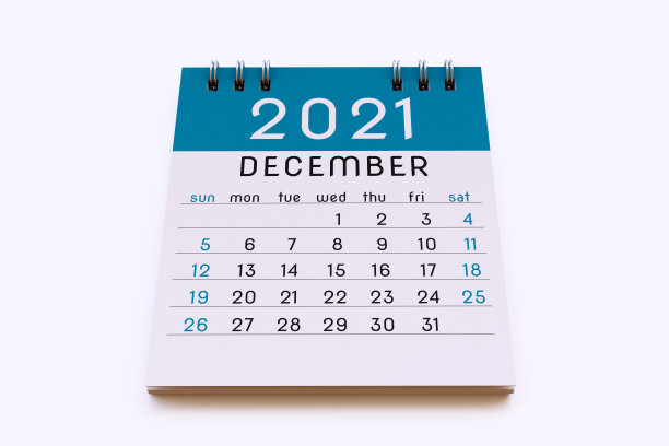 12月2021年日历记事本页在不饱和的蓝色，孤立在白色背景上图片下载