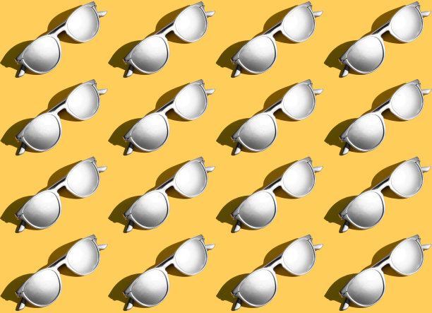 白色眼镜图案上的黄色背景图片下载