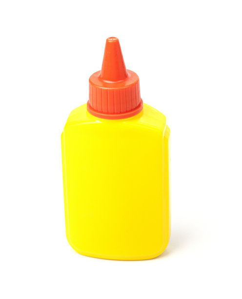 一管黄色文具胶，用于隔离在白色背景上的纸张图片下载