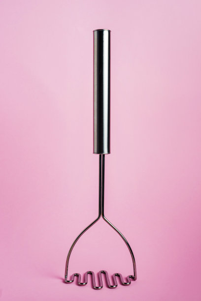 厨房用具的抽象照片在粉红色的背景-食物工具正面视图图片下载