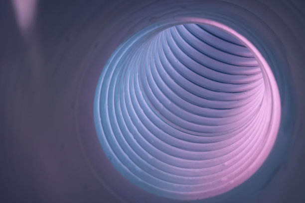 美丽的圆形抽象白灰色隧道与彩色灯光在背景图案纹理福特设计。图片下载