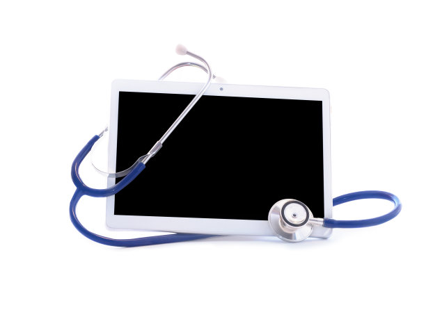 背景为白色药片和听诊器。在线医疗保障理念。图片下载