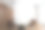 白色墙壁上的两张棕色扶手椅和咖啡桌上的帆布模型框架图片下载