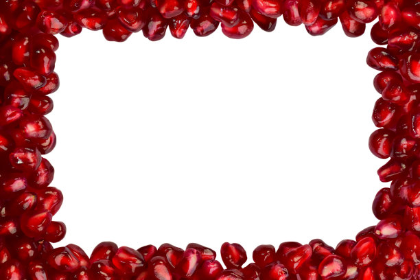 鲜亮多汁的石榴籽散布在四周。在中心有一个空白的空间，可以在白色的背景上题字图片下载