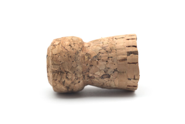 白色背景上的香槟软木塞图片下载