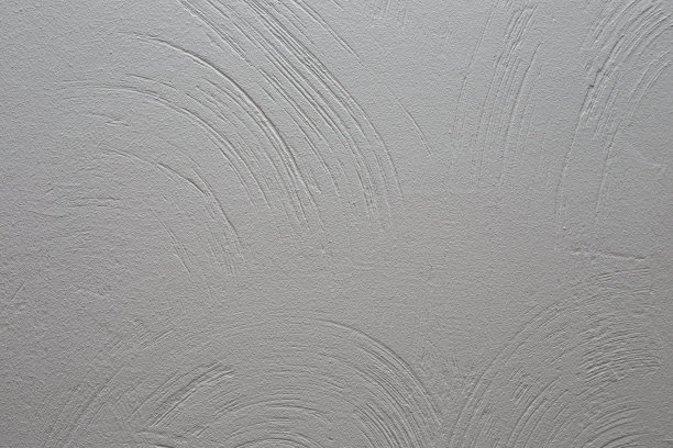装饰石膏。用灰泥涂成圆形条纹的墙，漆成灰色。背景为文本图片下载