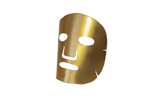 单布全息金生物胶原面膜。在白色背景上敷面膜。美容、医药和保健。图片下载