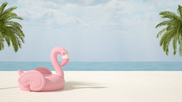 粉红色的充气火烈鸟在海滩上，最小的夏季和旅游概念图片下载