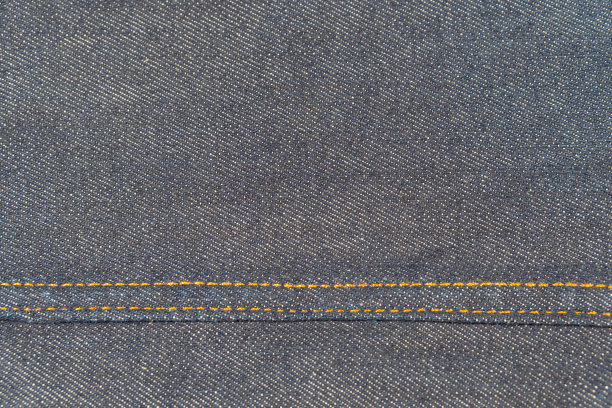 蓝色牛仔裤纹理与接缝的织物。为背景。图片下载