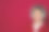 年轻帅气的学生戴着绿松石耳机，穿着红色毛衣图片下载