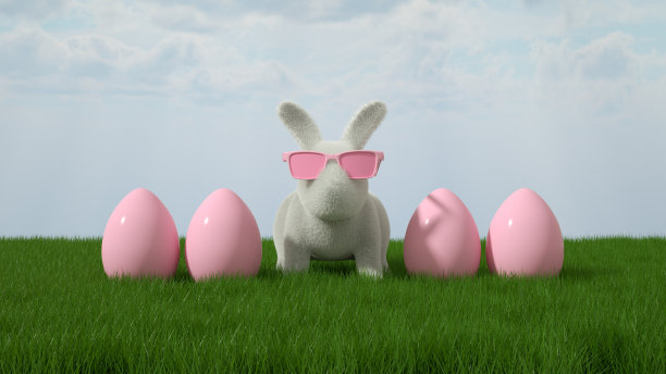 草地上的复活节兔子和复活节彩蛋素材图片