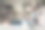 年轻帅哥的全身像侧面照片快乐正面微笑远程工作笔记本电脑坐在地板室内图片下载