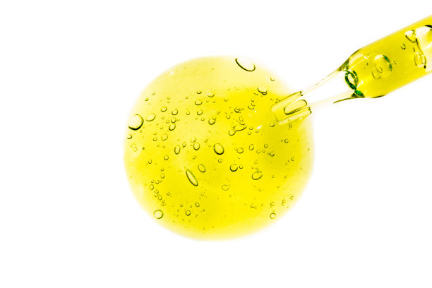 黄色液体凝胶或血清在白色分离背景上图片下载