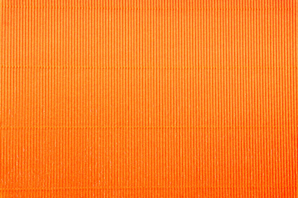 橙色瓦楞纸板特写。大的纹理，孤立的背景图片下载