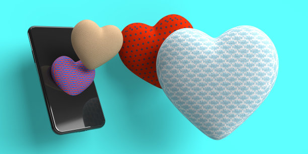 可爱的心和智能手机。图片下载