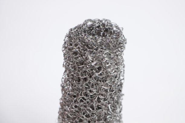 照片的轧制灰色金属编织网格在白色的背景图片下载