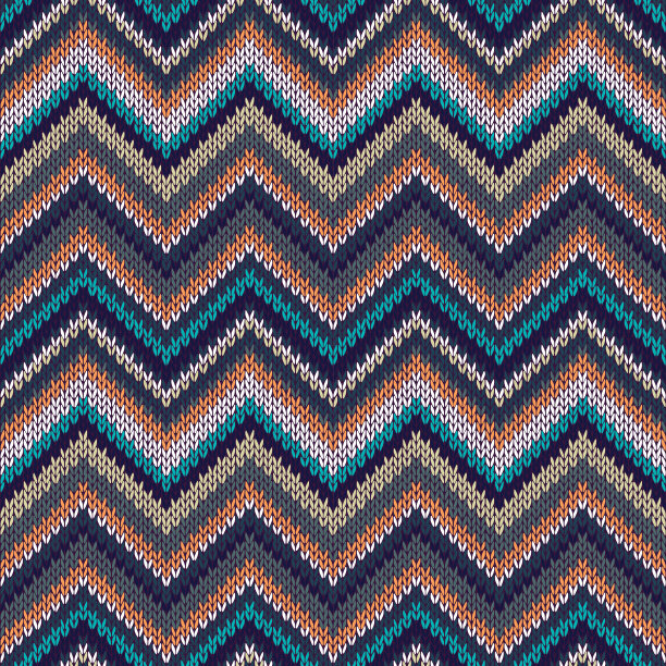 无缝几何民族辐条针织图案。蓝、白、橙、米色针织品样品图片下载