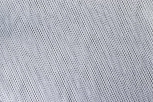 网眼织物纹理。白色织物背景。洗衣袋特写镜头图片下载