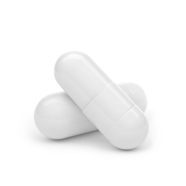 两粒药被分离在白色背景上图片下载
