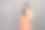 时尚肖像美丽的女人穿着橙色连衣裙孤立在灰色背景的工作室图片下载