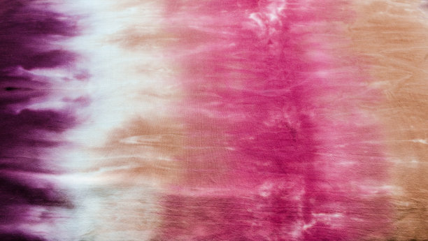 彩色扎染图案抽象背景。手工设计，色彩柔和的棉织物。图片下载