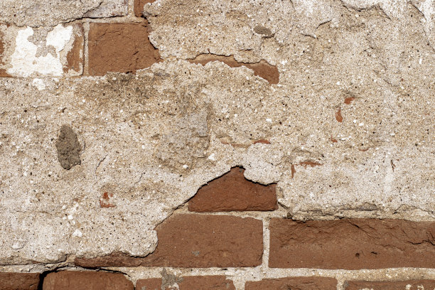 旧砖墙的纹理与破坏的灰泥。作为背景或背景的经典砖砌作品。图片下载
