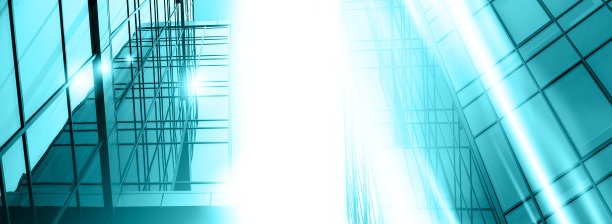 摘要商业现代城市城市未来建筑背景。房地产概念，动态模糊，高层摩天楼立面的玻璃反射，色调蓝色的画面与散景图片下载