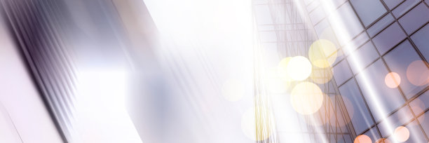 摘要商业现代城市城市未来建筑背景。房地产概念，动态模糊，高层摩天楼立面的玻璃反射，色调蓝色的画面与散景图片下载