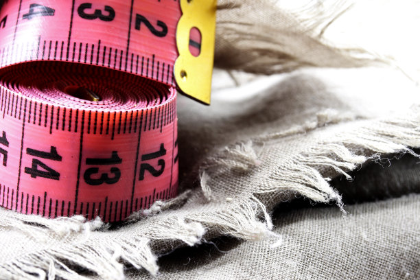 用卷尺测量织物背景图片下载