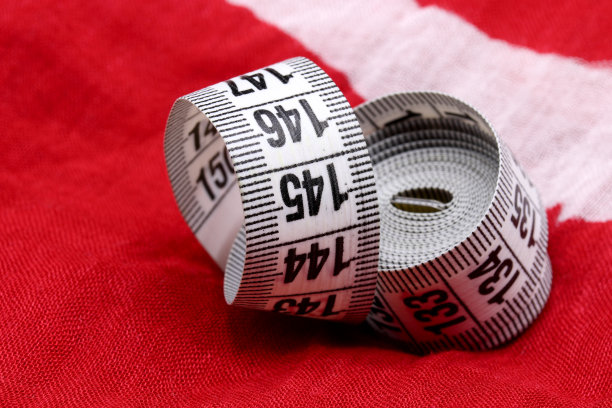 用卷尺测量织物背景图片下载