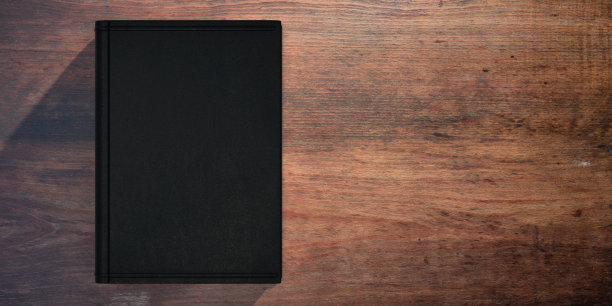 书的皮革封面上木制桌子的背景。三维演示图片下载