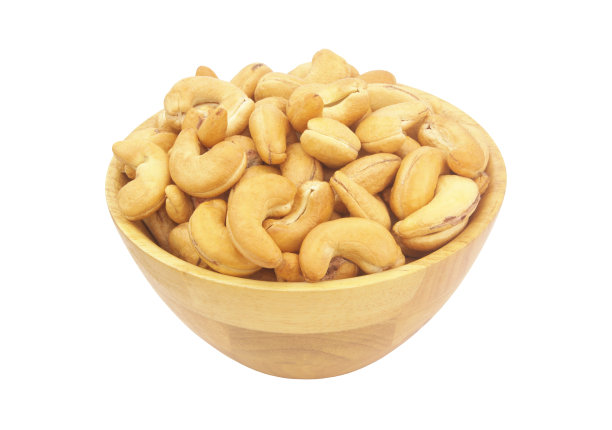 腰果在木碗上孤立白色图片下载