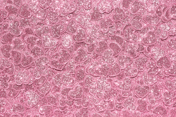 闪亮的粉色亮片心背景。你的设计背景。图片下载