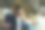男企业家坐公交车上班时喝着外卖咖啡。图片下载