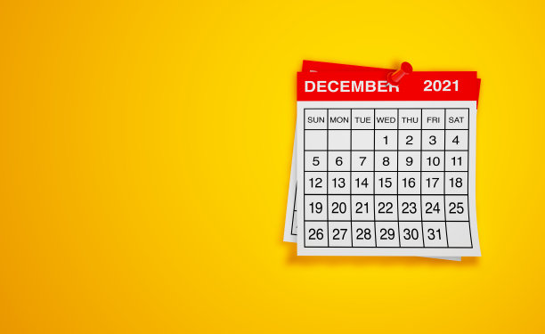 12月2021年日历上的黄色背景图片下载