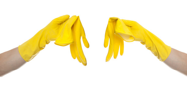 黄色橡胶手套清洁在白色背景，济贫院的概念图片下载
