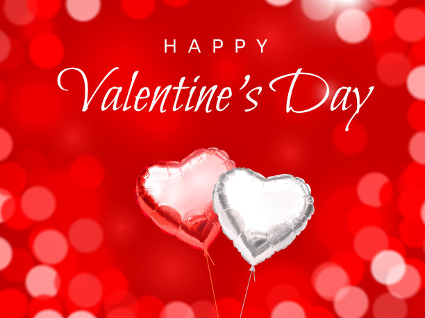 情人节贺卡快乐。一对心形的氦气球，由银色和红色的箔纸制成，红色模糊的散焦背景上印有祝贺文字。现实的膨胀的气球图片下载