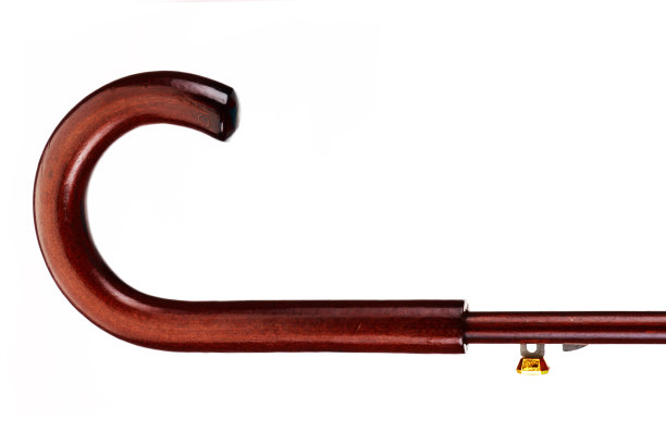 深色木质伞柄上的白色背景图片下载