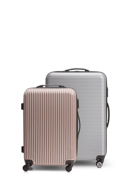 带轮子的银和金玫瑰手提箱图片下载