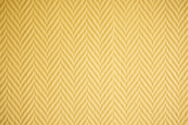 抽象背景图案的黄色浮雕墙纸与对角倾斜的图案图片下载