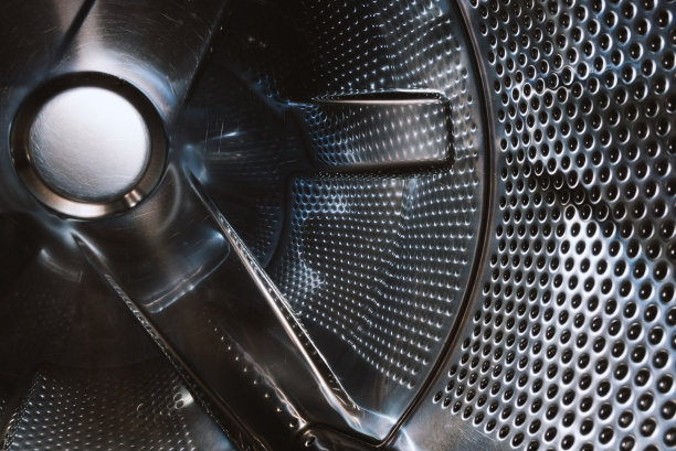 抽象的孔纹理不锈钢金属为背景。浅景深的背景。图片下载