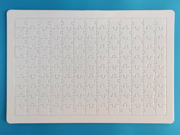 空白的白色拼图在蓝色的背景图片下载