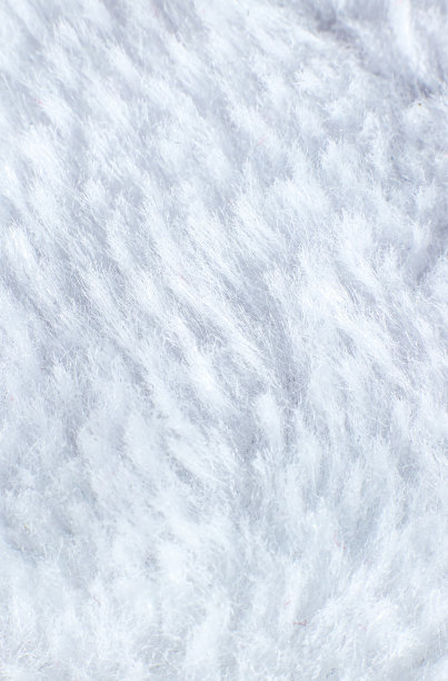 白色棉布毛巾或地毯“绒毛质地背景。近距离的照片。图片下载