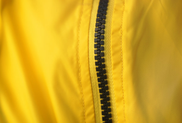 黄色面料表面和拉链纹理背景图片下载