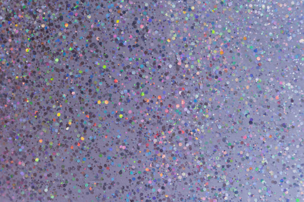 抽象的紫色背景与多色的火花。图片下载